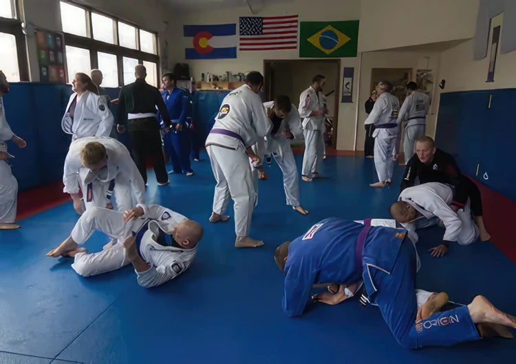 Brazilian Jiu-Jitsu students practicing on the mat during a class session